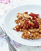 Pan-fried chicken with chick-peas and red peppers