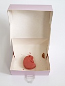 Pink macaron (small French cake) in a box