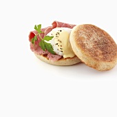 Ham and poached egg in English muffin