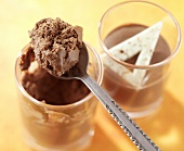 Chocolate mousse in glass and on spoon