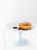 A doughnut with a blob of jam
