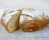 Round white loaf, a wedge cut