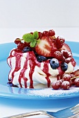 Meringue with fresh berries and berry sauce