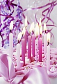Pink birthday cake with candles