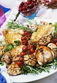 Roast partridges with garlic, cocktail tomatoes and rosemary