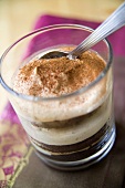 Tiramisu in a glass with a spoon