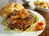 Burger with onion relish and capers