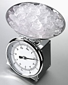 Ice cubes on kitchen scales