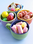 Assorted sweets in four cups