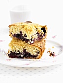 Two pieces of blueberry crumble cake
