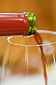 Pouring red wine (close-up)