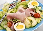 Iceberg lettuce with ham, egg and cucumber