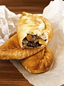 Two whole Cornish pasties & one with a bite taken (England)