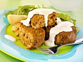 Salmon fishcakes with mayonnaise and green salad