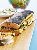 Baked salmon stuffed with lemon and herbs