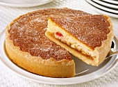 Apple Bakewell tart, a piece cut
