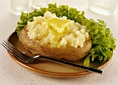A baked potato with butter