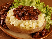 A baked potato with chili con carne