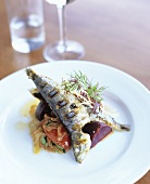 Grilled sardine on tomatoes and beetroot