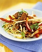 Stir-fried rice noodles, beef and vegetables