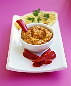 Hummus with red peppers and pita bread