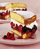 Sponge cake filled with berries and whipped cream