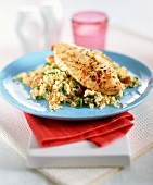 Chicken breast on a bed of couscous