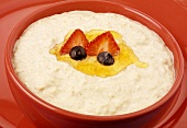 Porridge with honey, strawberry and blueberries