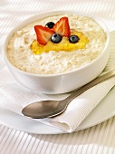 Porridge with honey, strawberry and blueberries