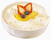 Porridge with honey, strawberry and blueberries