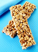 Two peanut bars on blue background