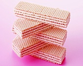 Pink wafer sandwich biscuits, in a pile
