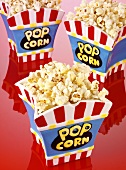 Popcorn in three ceramic popcorn bowls