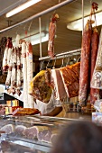 Assorted sausage products for sale in a mobile butcher's shop