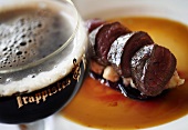 Dark beer with venison loin fillet on red wine sauce