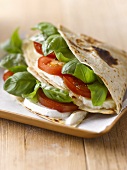 Tomato, mozzarella and basil in flatbread