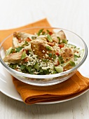 Fried chicken breast on couscous salad