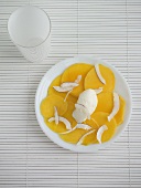 Mango carpaccio with strips of coconut & coconut ice cream