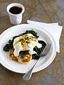 Poached egg on potato pancake and spinach