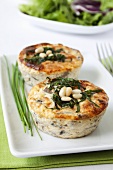 Small mushroom and mozzarella quiches with pine nuts