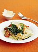 Grilled squid with rocket, tomatoes and cheese shavings