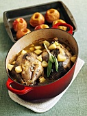 Pheasants in casserole dish, baked apples