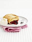 Apple, blackberry strudel with whipped cream