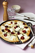 Pizza with ricotta, cherry tomatoes and rosemary