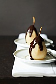 Poached pear with chocolate sauce