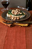 Green cabbage and bean crostini