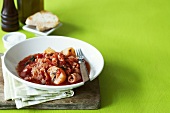 Octopus with potatoes and tomato sauce