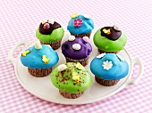Muffins with coloured icing for Easter