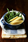 Green beans and baby corn in pot