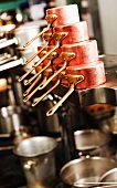 Copper saucepans and other pans in a commercial kitchen